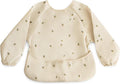 mushie Long Sleeve Baby Bib | Water Resistant Adjustable Fit for Ages 6-24 Months