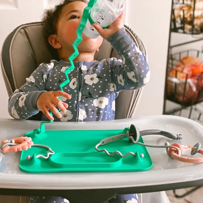 Busy Baby Gift Set - Silicone Placemat with Suction Cups, Bottle Bungee, Teething Spoon and 4 Universal Straps, Keeps Baby Essentials Like Bottles Within Reach & Off The Floor (Spearmint)