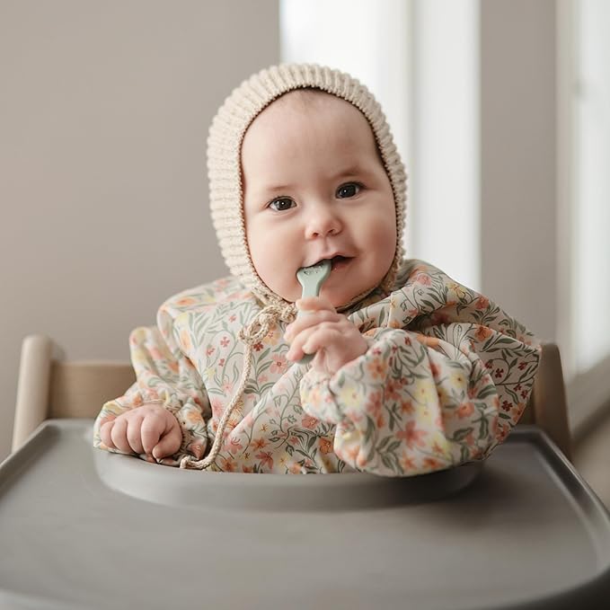 mushie Long Sleeve Baby Bib | Water Resistant Adjustable Fit for Ages 6-24 Months