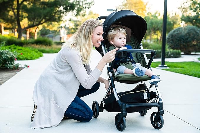 Joovy Kooper Lightweight Baby Stroller Featuring Removable, Swing-Open Tray, Big Wheels, Reclining Seat with Footrest, Extra-Large Retractable Canopy, and Compact Fold (Olive)